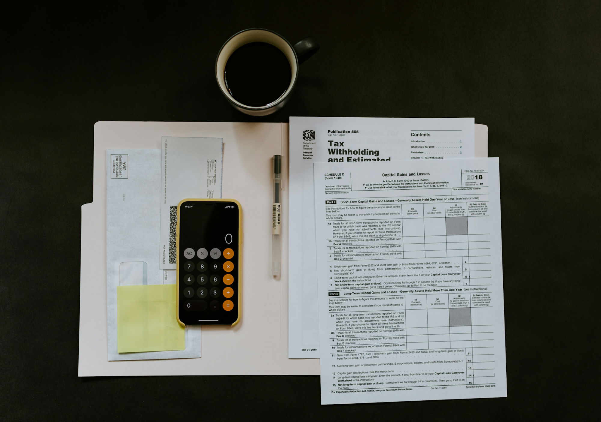 black-android-smartphone-near-ballpoint-pen--tax-withholding-certificate-on-top-of-white-folder.jpg black Android smartphone near ballpoint pen, tax withholding certificate on top of white folder